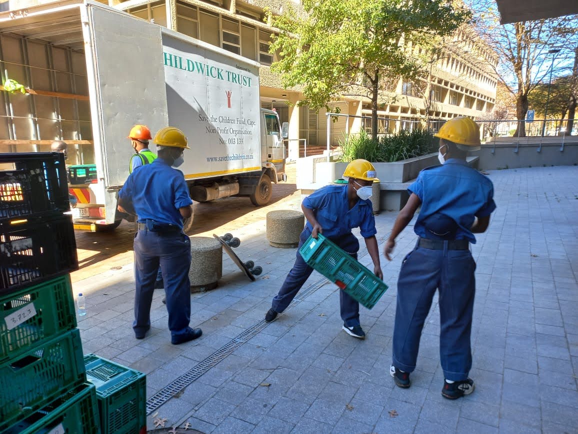 Sea Cadets unloading crates from the truck.